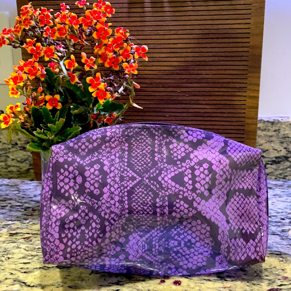 Purple snakeskin Estee Lauder cosmetic bag